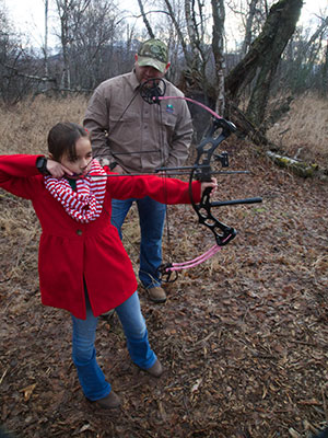 Hunter mentors young bowhunter