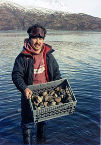 Fisherman with a crate of clams