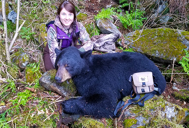 Successful hunter with black bear