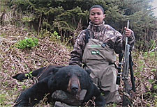 Photo of a successful Black Bear hunter.